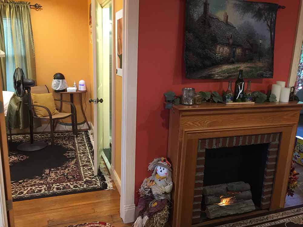 Sitting room with fireplace and antique furniture