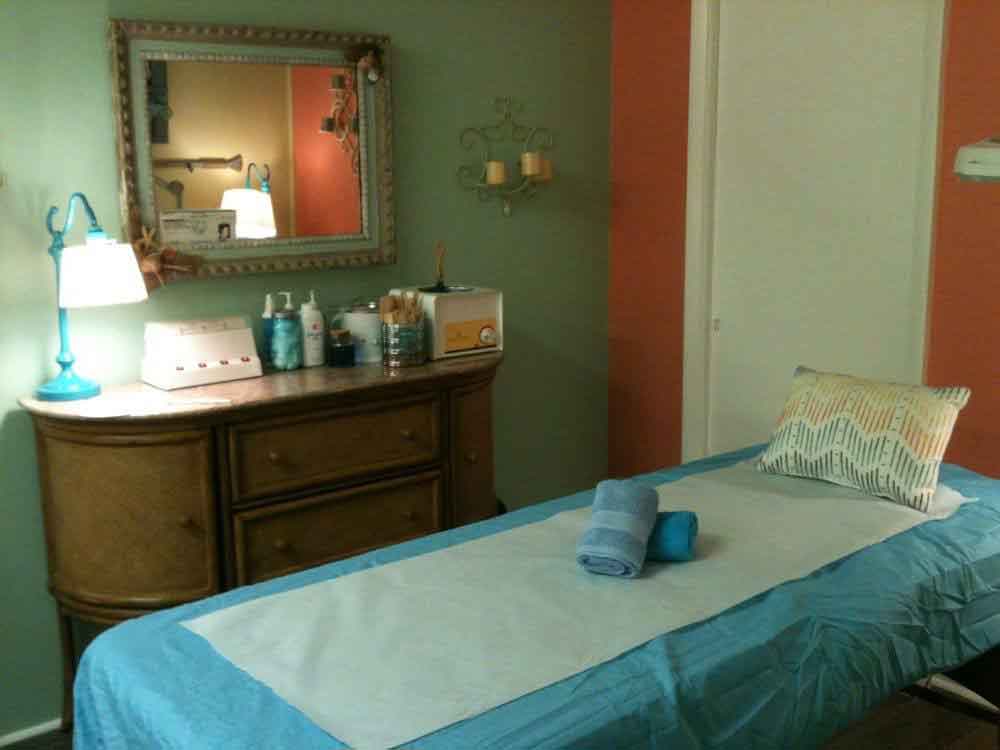 Treatment room with waxing table made up and ready