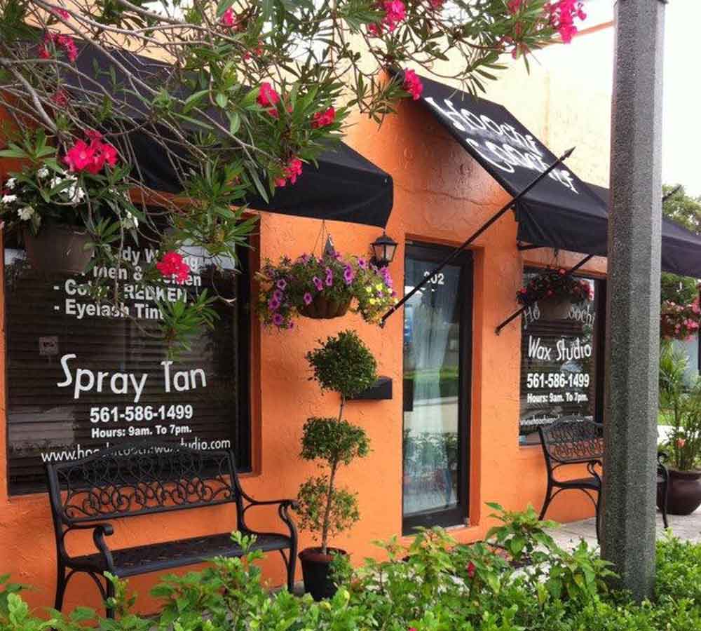 Studio entrance with menu board on the street